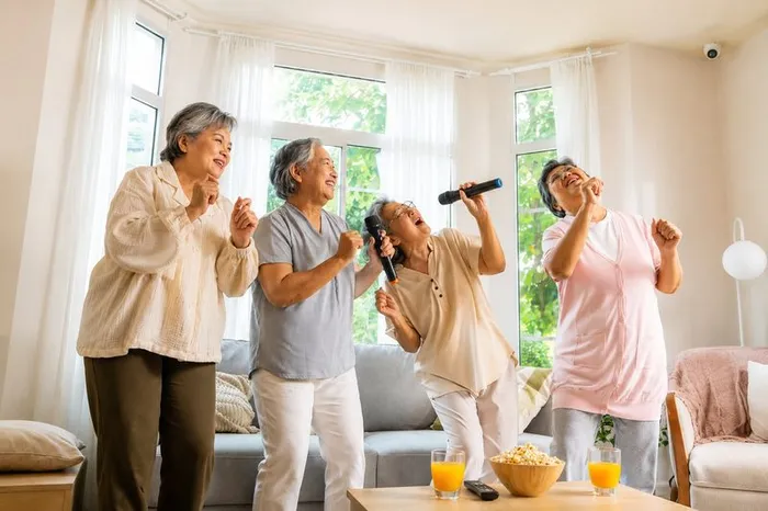 Mood dan Sosial — senior group singing and dancing